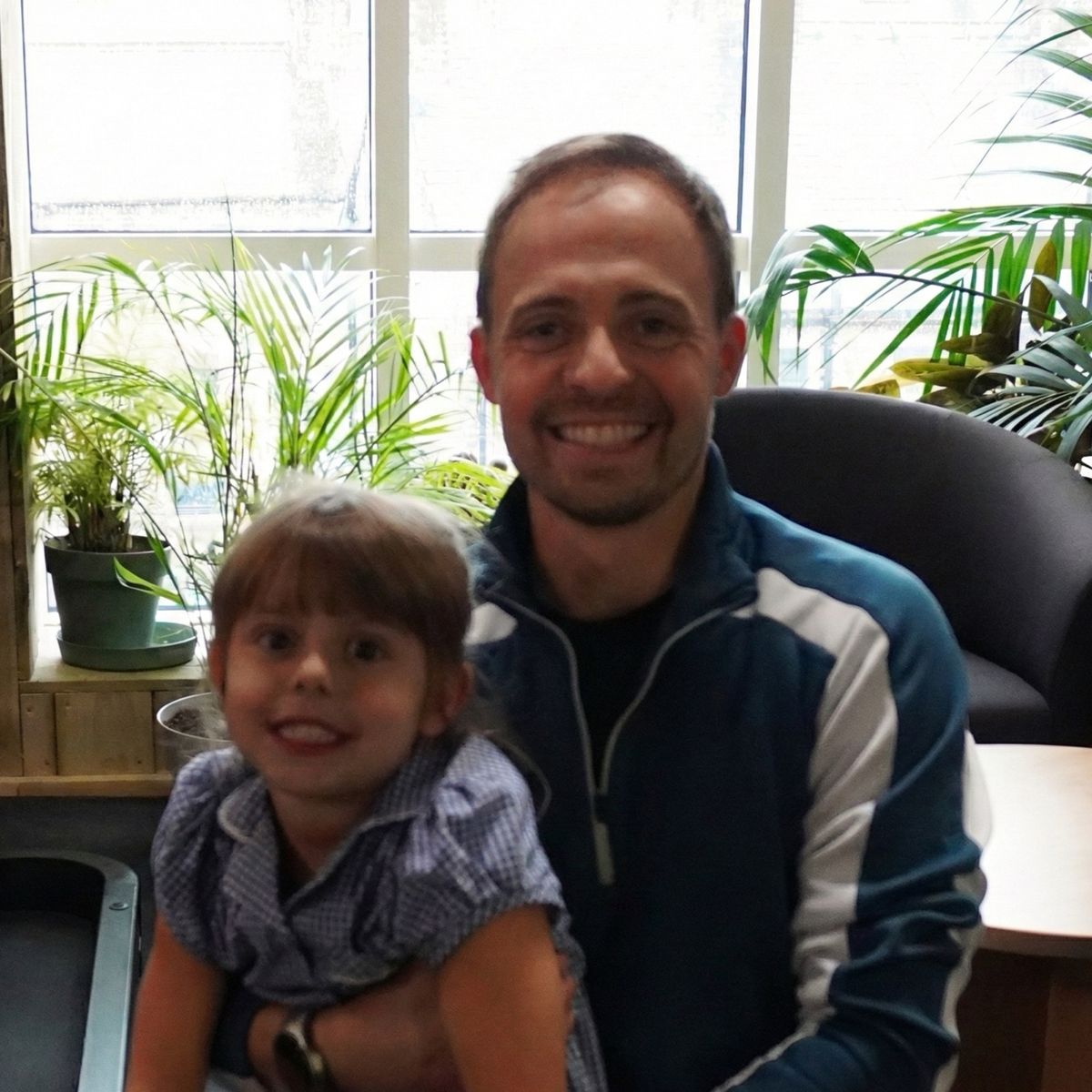 Sam, owner of Core Fitness, with his daughter at the gym